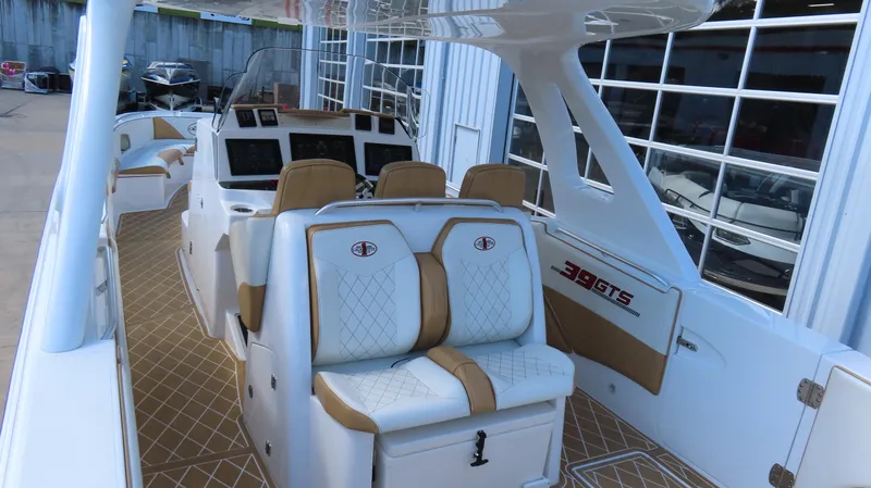 Slide: The Image of 2016 Cigarette 39 GTS boat interior with luxury seating and modern dashboard. - 7