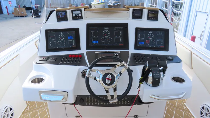 Slide: The Image of 2016 Cigarette 39 GTS boat dashboard with advanced navigation controls and displays. - 8