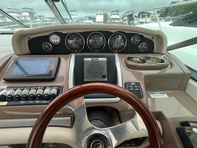 Slide: The Image of Dashboard of 2014 Crownline 294 CR boat with gauges and controls. - 14