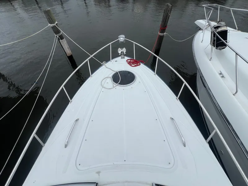Slide: The Image of 2014 Crownline 294 CR boat docked, top view of bow and railing. - 29