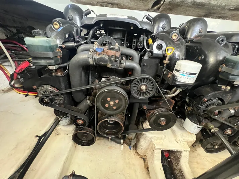 Slide: The Image of Engine compartment of a 2014 Crownline 294 CR boat, showcasing mechanical components. - 36