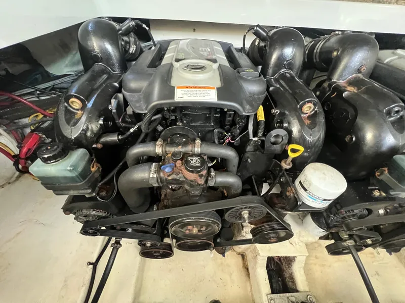 Slide: The Image of Engine of a 2014 Crownline 294 CR boat, showcasing mechanical components. - 37