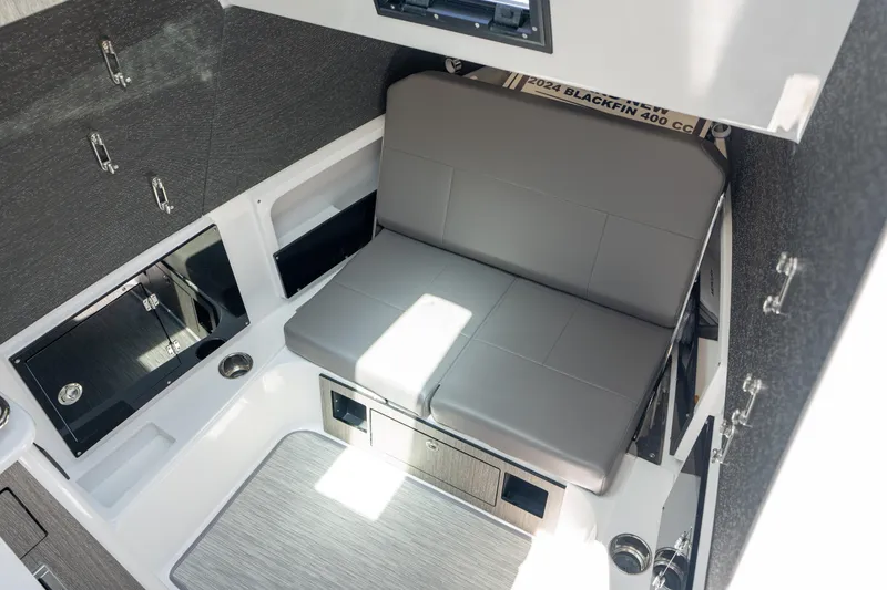 Slide: The Image of 2024 Blackfin 400CC cabin interior with gray seating and modern design elements. - 27