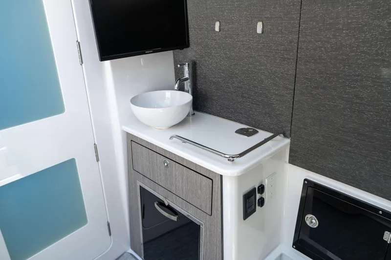 Slide: The Image of 2024 Blackfin 400CC interior with modern sink, sleek cabinetry, and minimalist design. - 35