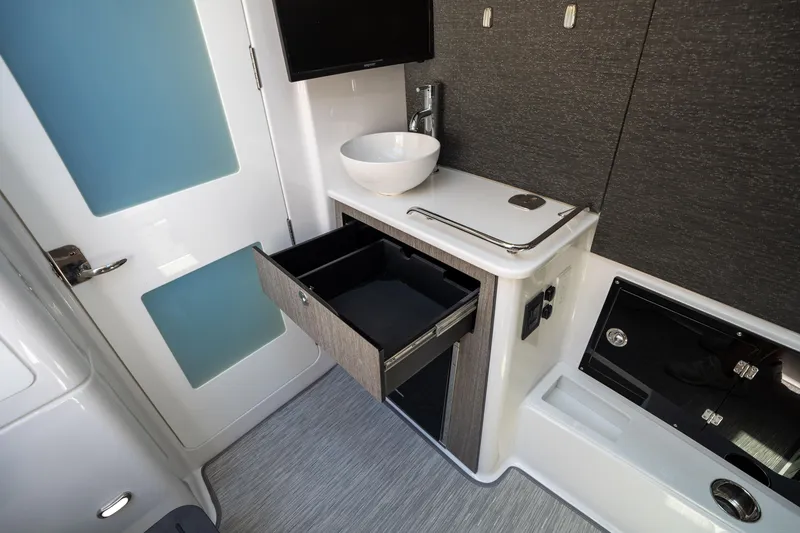 Slide: The Image of 2024 Blackfin 400CC interior with modern sink, open drawer, and sleek design. - 42