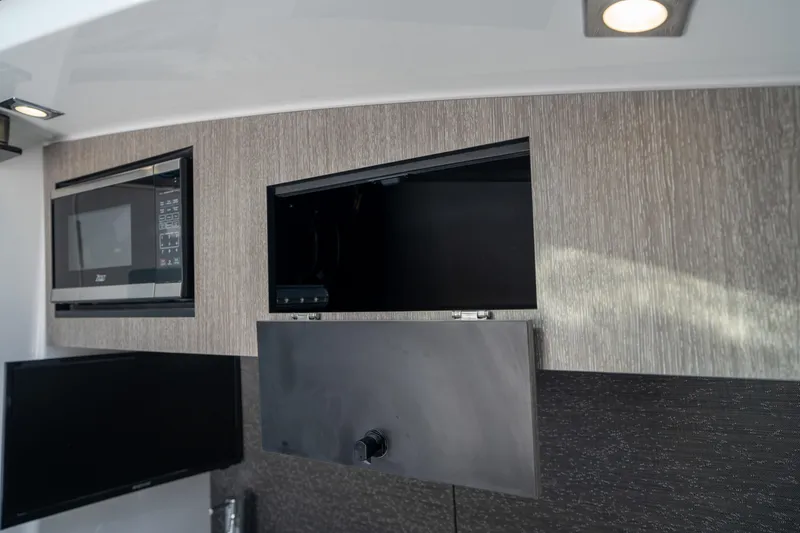 Slide: The Image of 2024 Blackfin 400CC interior with modern cabinetry and built-in appliances. - 43