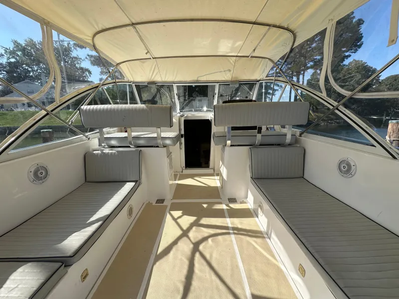 Slide: The Image of 2002 Mainship Pilot 34 boat interior with seating and canopy. - 6
