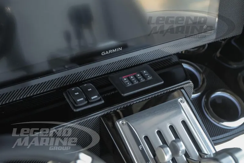 Slide: The Image of 2025 Nor-Tech 340 Sport Center Console dashboard with Garmin navigation system. - 18