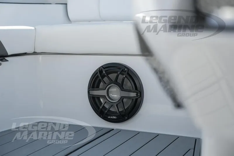 Slide: The Image of 2025 Nor-Tech 340 Sport Center Console interior with marine speaker and seating. - 25