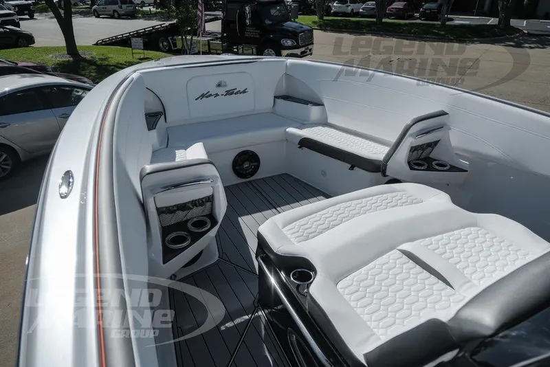 Slide: The Image of 2025 Nor-Tech 340 Sport Center Console boat interior with luxurious seating and modern design. - 26