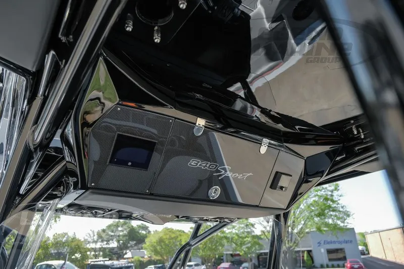 Slide: The Image of 2025 Nor-Tech 340 Sport Center Console dashboard with sleek black design and advanced controls. - 41