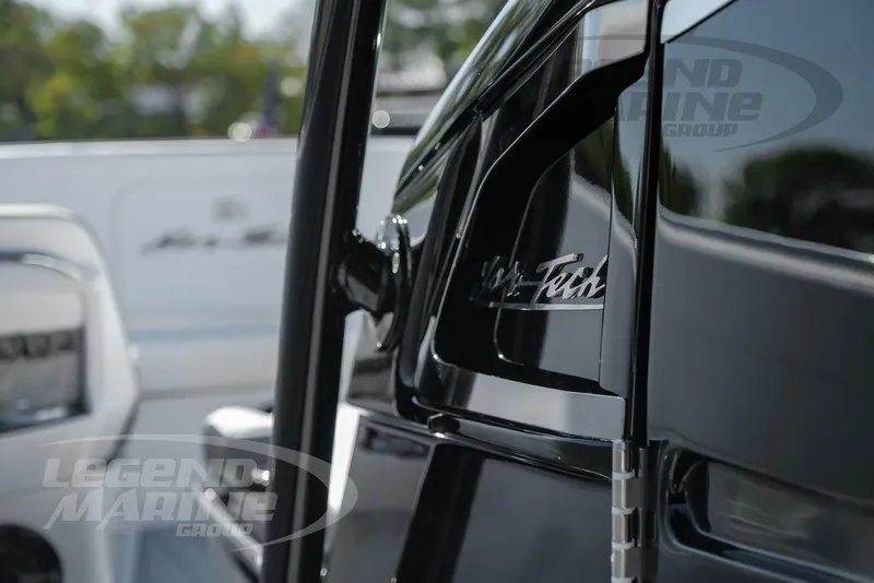 Slide: The Image of 2025 Nor-Tech 340 Sport Center Console, sleek black design, Legend Marine Group branding. - 45