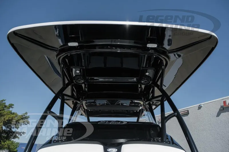Slide: The Image of 2025 Nor-Tech 340 Sport Center Console boat with sleek black T-top design. - 49