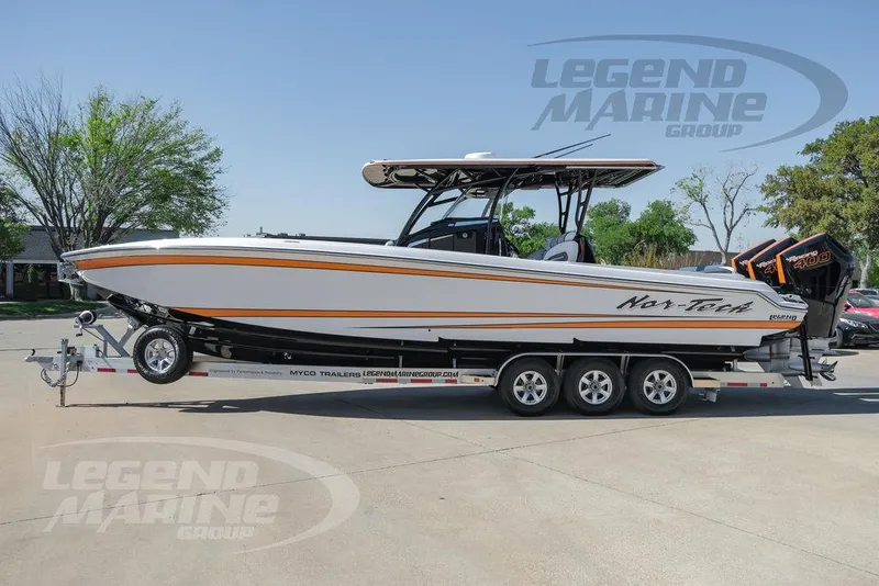 Slide: The Image of 2025 Nor-Tech 340 Sport Center Console boat on trailer, side view. - 8