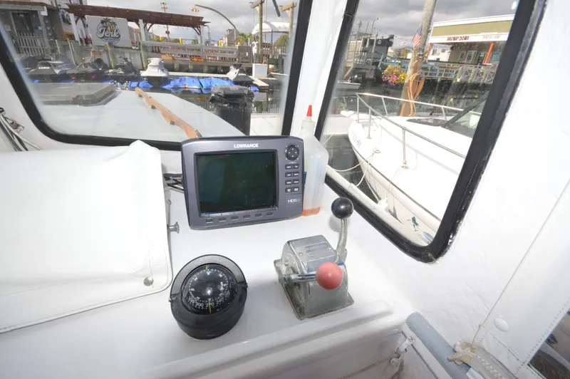 Slide: The Image of Control panel of 1983 BHM 25 EXPRESS boat with navigation equipment and compass. - 10