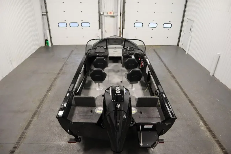 Slide: The Image of 2025 Crestliner 1950 Super Hawk boat in a spacious indoor garage. - 10