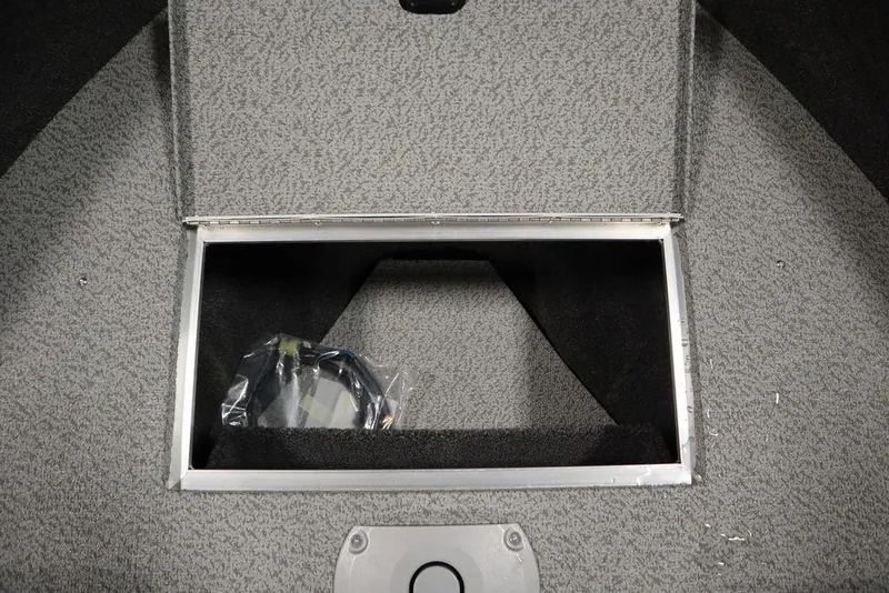 Slide: The Image of Crestliner 1950 Super Hawk 2025 storage compartment with gray interior. - 14