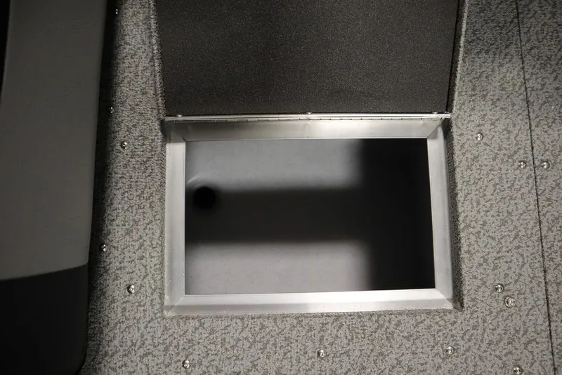 Slide: The Image of 2025 Crestliner 1950 Super Hawk storage compartment with textured flooring. - 15