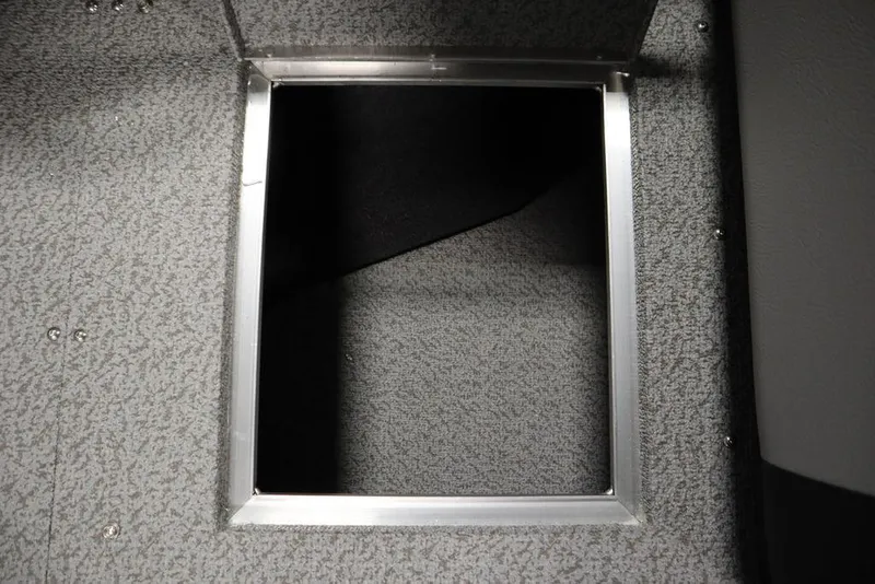 Slide: The Image of Crestliner 1950 Super Hawk 2025 boat storage compartment with metal frame. - 16