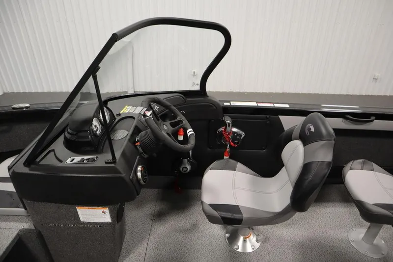 Slide: The Image of 2025 Crestliner 1950 Super Hawk boat interior with steering wheel and seating. - 17