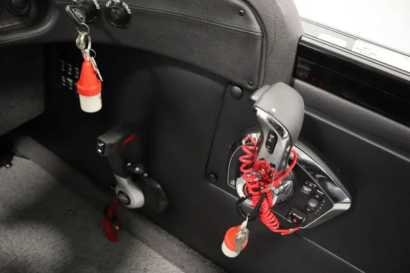 Slide: The Image of Interior controls of 2025 Crestliner 1950 Super Hawk boat with keychains. - 22