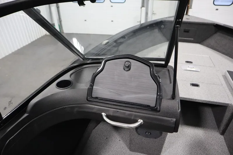 Slide: The Image of 2025 Crestliner 1950 Super Hawk boat interior with open windshield and storage compartment. - 27