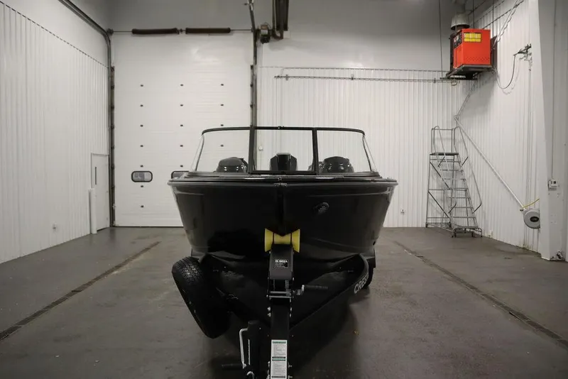 Slide: The Image of 2025 Crestliner 1950 Super Hawk boat in a garage, front view. - 3