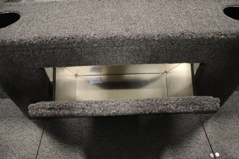 Slide: The Image of 2025 Crestliner 1950 Super Hawk interior storage compartment with carpeted finish. - 33