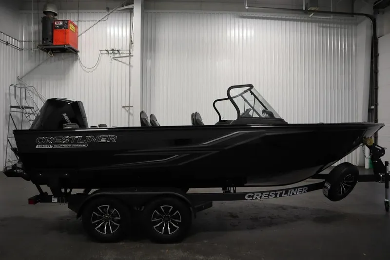Slide: The Image of 2025 Crestliner 1950 Super Hawk boat in a garage setting. - 4