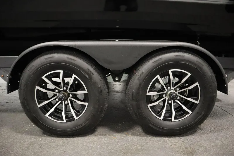 Slide: The Image of 2025 Crestliner 1950 Super Hawk trailer wheels, black and silver design, dual axle. - 42