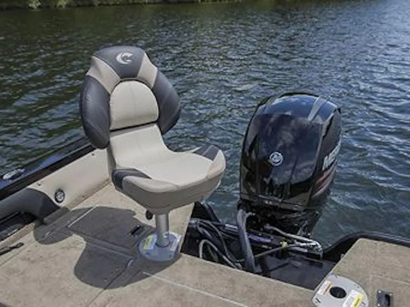 Slide: The Image of 2025 Crestliner 1950 Super Hawk boat with comfortable seating and powerful outboard motor on a lake. - 45