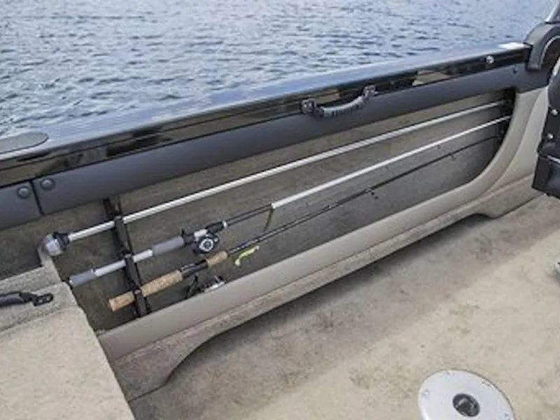 Slide: The Image of 2025 Crestliner 1950 Super Hawk fishing rod storage on a boat by the water. - 49