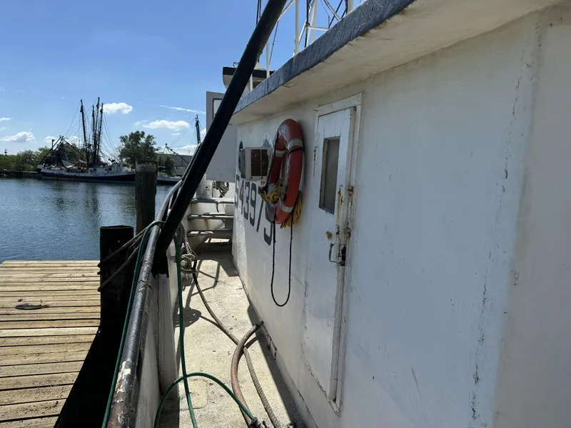 Slide: The Image of 1972 Commercial Shrimp Freezer Trawler docked by a wooden pier. - 4
