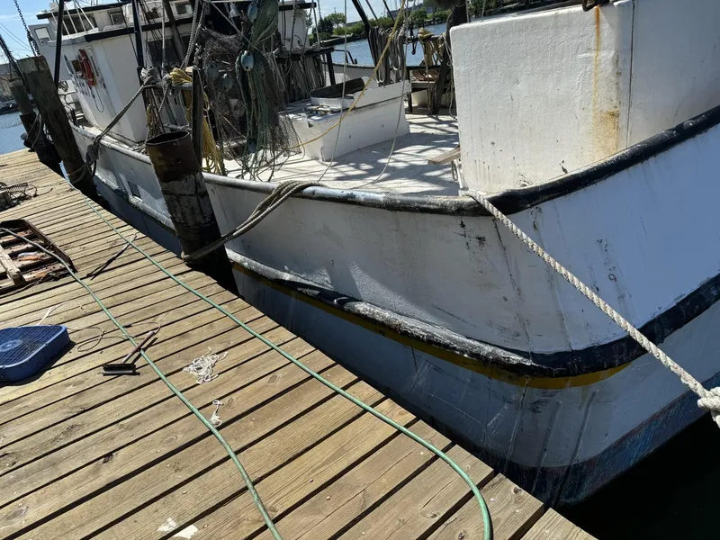 Slide: The Image of 1972 Commercial Shrimp Freezer Trawler docked at a wooden pier. - 5