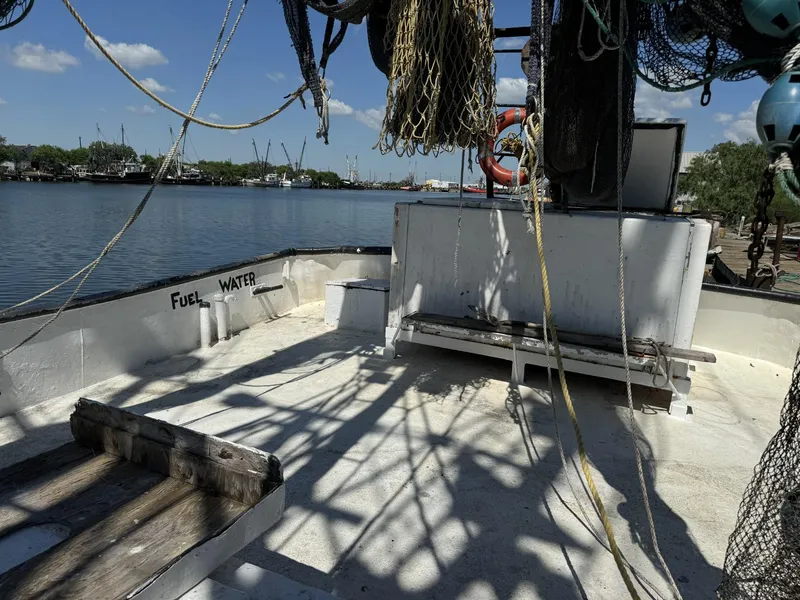 Slide: The Image of 1972 Commercial Shrimp Freezer Trawler deck with fishing nets and equipment. - 6