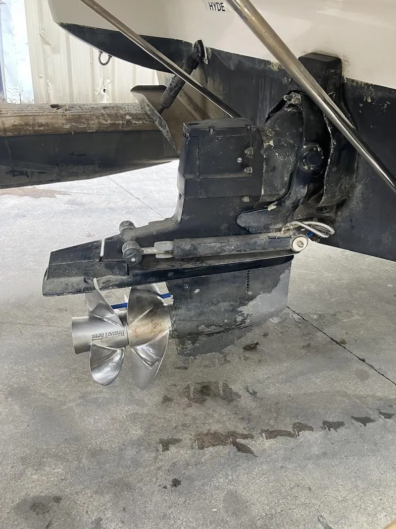 Slide: The Image of 2001 Doral 270 SC boat propeller and stern drive in a garage. - 15