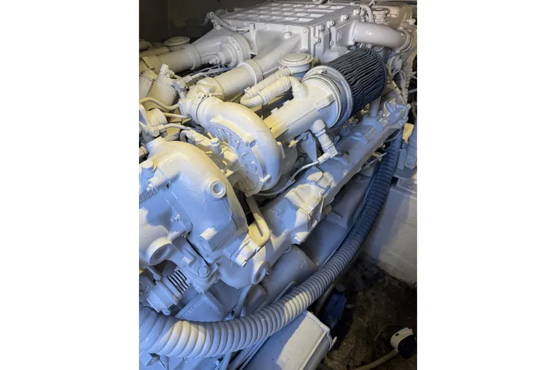 Slide: The Image of Engine of 1987 Ocean Yachts 63 Convertible Manns, showcasing intricate mechanical components. - 21