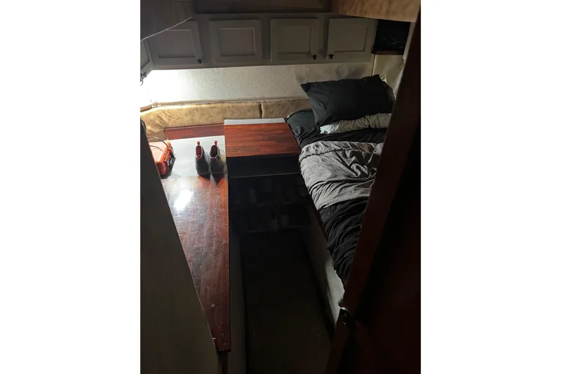 Slide: The Image of Cozy cabin interior of 1987 Ocean Yachts 63 convertible Manns with bed and storage. - 15