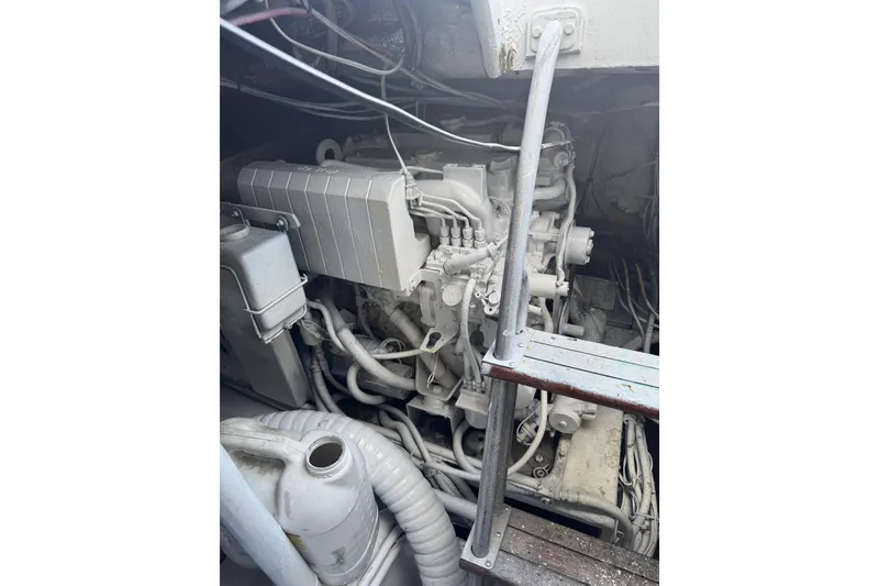 Slide: The Image of Engine compartment of 1987 Ocean Yachts 63 Convertible Manns, showcasing mechanical components. - 20