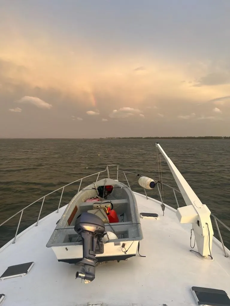 Slide: The Image of Bow of Ocean Yachts 63 Convertible at sunset. - 4