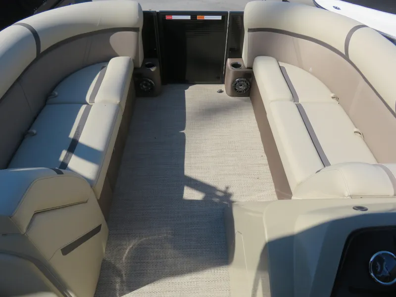 Slide: The Image of 2023 Crest Classic LX 220 interior with beige seating and carpeted floor. - 7