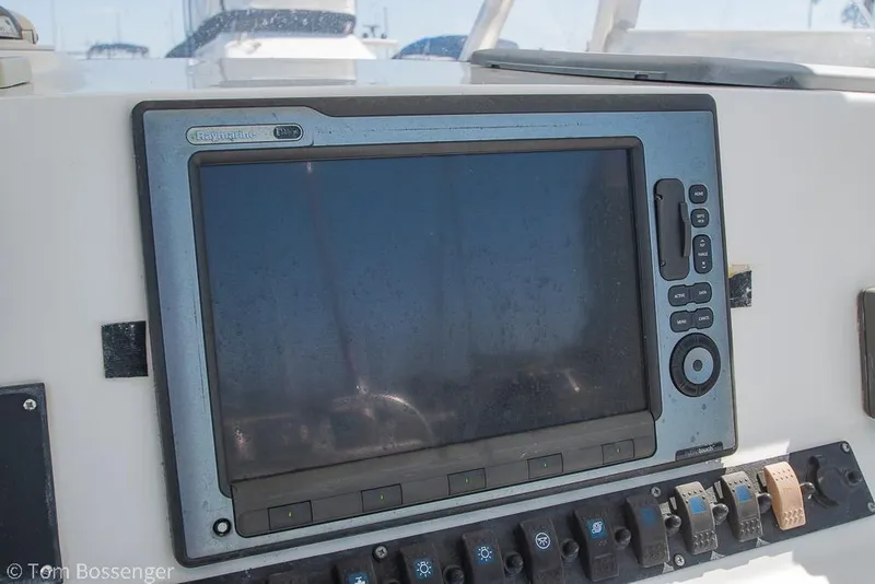 Slide: The Image of Control panel of a 2010 Sea Hunt Gamefish 29 boat, featuring navigation equipment. - 10
