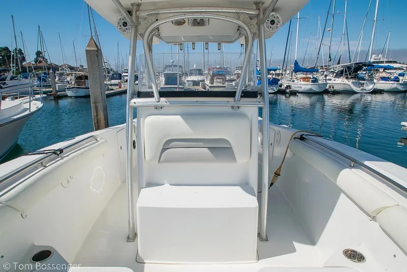Slide: The Image of 2010 Sea Hunt Gamefish 29 boat interior at marina, surrounded by other boats. - 19
