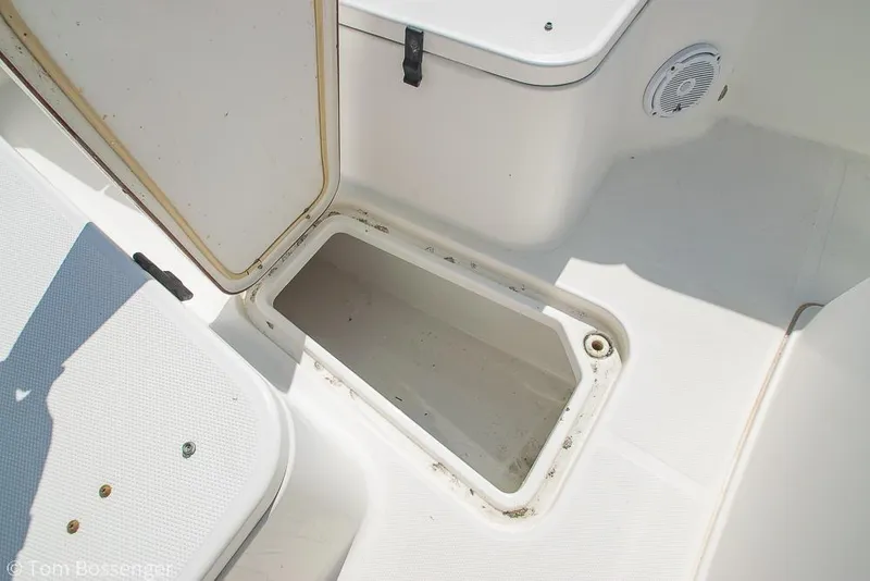 Slide: The Image of Open storage compartment on 2010 Sea Hunt Gamefish 29 boat deck. - 20