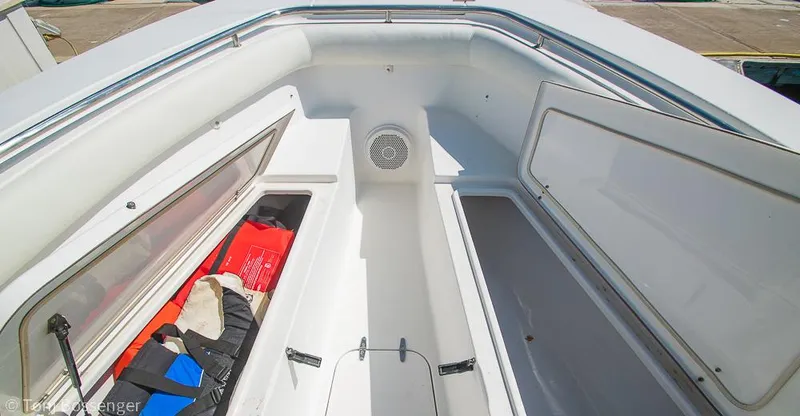 Slide: The Image of 2010 Sea Hunt Gamefish 29 boat storage compartments with life jackets and gear. - 21