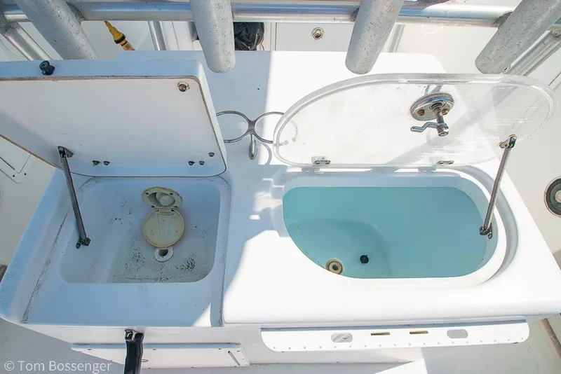 Slide: The Image of Open compartments on a 2010 Sea Hunt Gamefish 29 boat deck. - 24