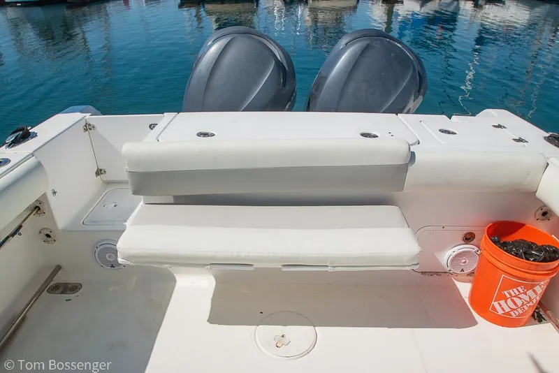 Slide: The Image of 2010 Sea Hunt Gamefish 29 boat interior with seating and twin engines. - 26