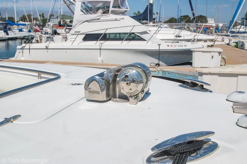 Slide: The Image of 2010 Sea Hunt Gamefish 29 boat deck with anchor winch in marina setting. - 31