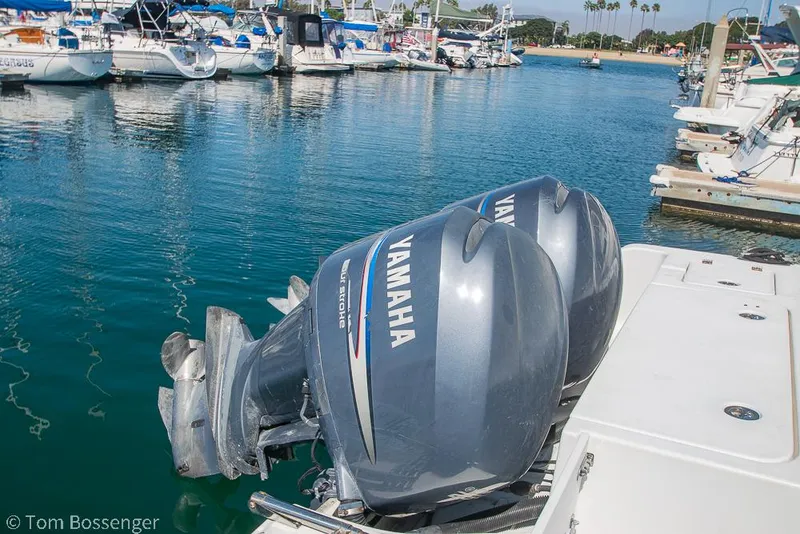 Slide: The Image of Twin Yamaha outboard motors on a 2010 Sea Hunt Gamefish 29 in a marina setting. - 33