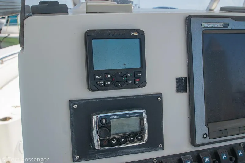 Slide: The Image of Control panel of a 2010 Sea Hunt Gamefish 29 boat with electronic displays. - 9